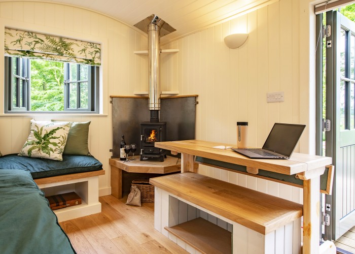 Escape to a serene cabin offering sweeping woodland and fellside views